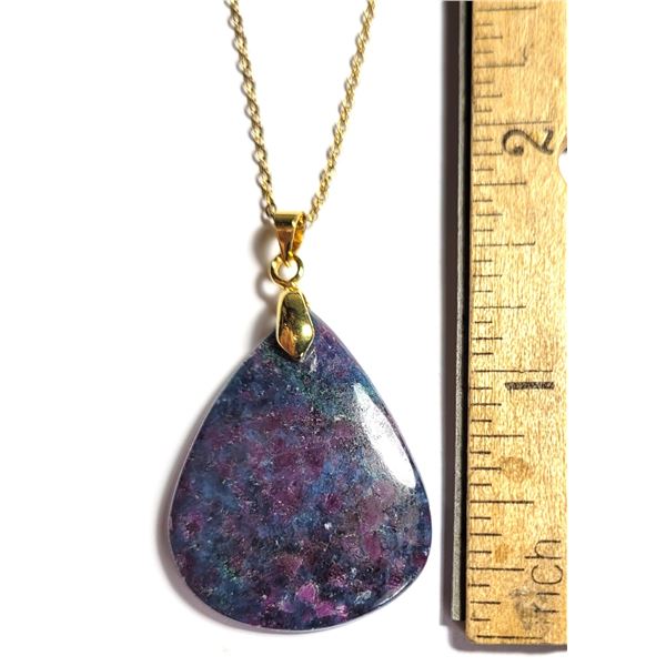 24)  PEAR SHAPED 38.5 CT RUBY KYANITE