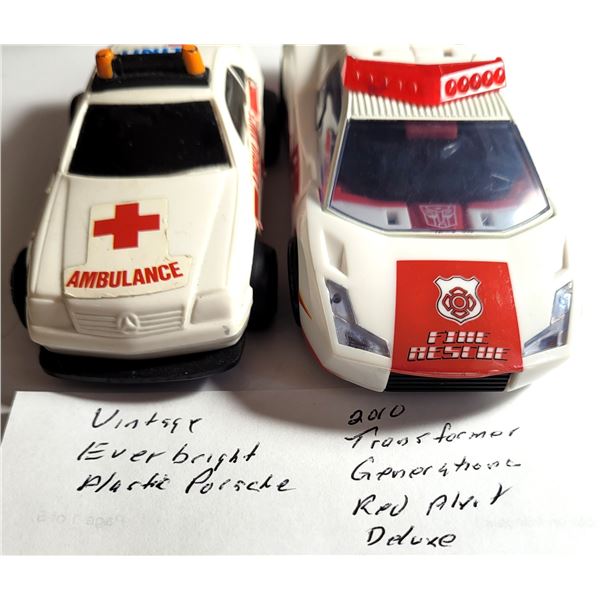 25) LOT OF 2 VINTAGE TOY CARS.