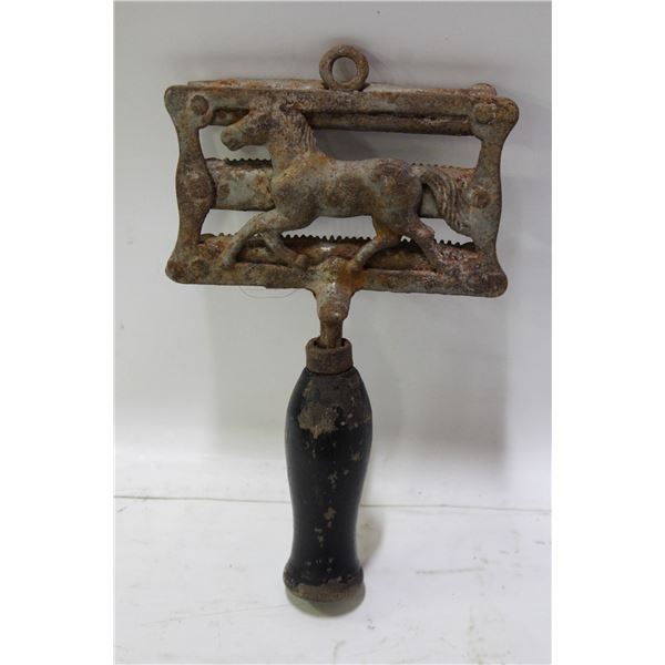 ANTIQUE HORSE CURRY COMB MADE OF RUSTED CAST IRON