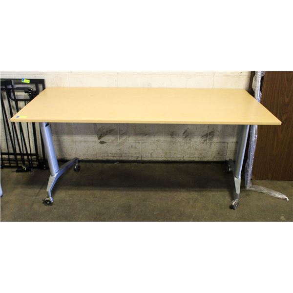 APPROX 67"X30" FOLDING TABLE ON CASTERS