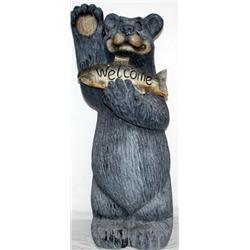 Statue Of A Bear With A Fish That Says Welcome