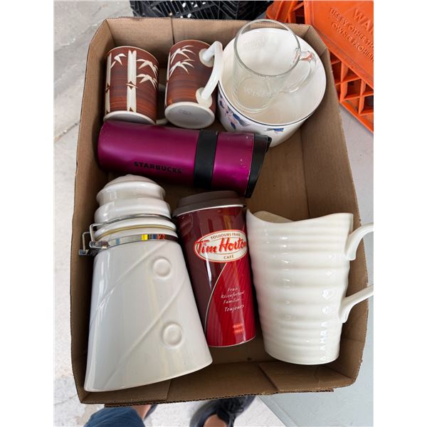 Assorted coffee cups, go mugs and other items