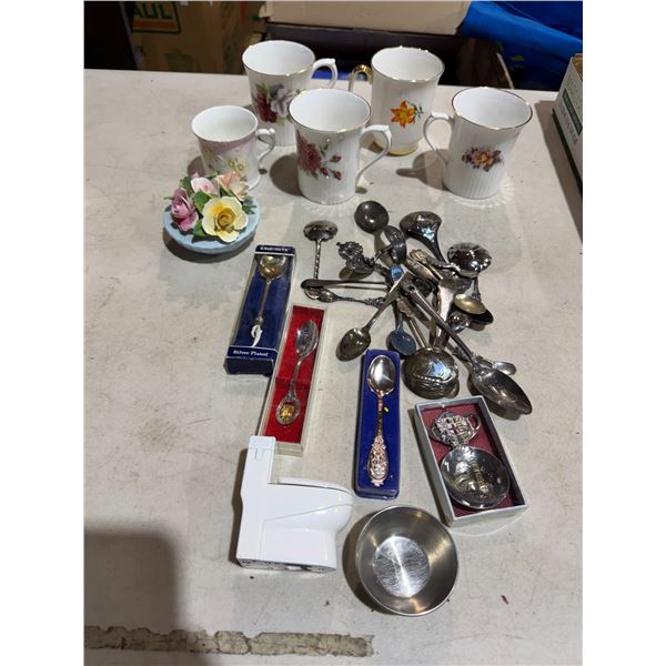 Collectible spoons and mugs and floral decor