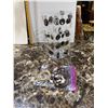 Image 1 : Earrings, bracelets, and stand