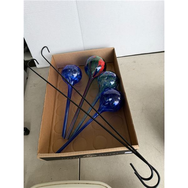 Glass watering globes and garden hooks
