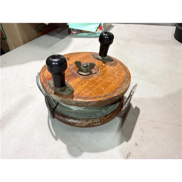 wooden PEETZ Fishing Reel, a classic handcrafted mahogany and brass trolling or mooching reel