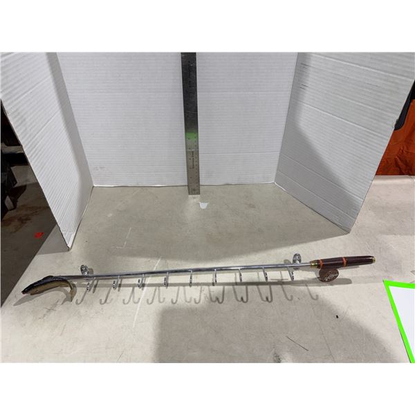 Fishing reel hook holder