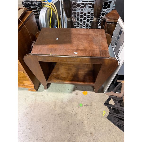 Antique table 27" x 13" x 23" tall has a small chip and topsy picture