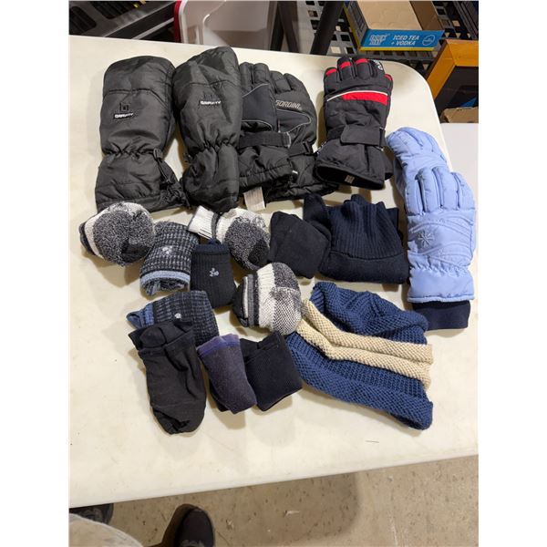 Assorted gloves and socks and toque