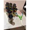 Image 1 : Tennis balls, golf tees, and racket