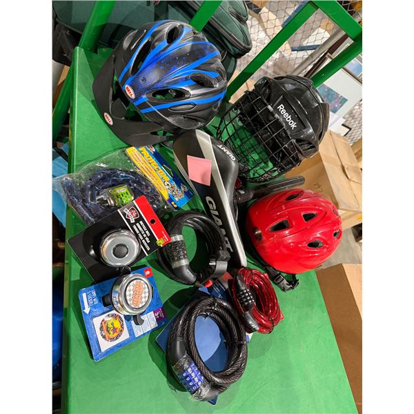 Sports items, new locks, bells, assorted helmets, and bike seat