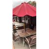 Image 1 : Patio Dining Set with Stone-Top Table, Four Cushioned Chairs, and Red Umbrella
