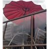 Image 8 : Patio Dining Set with Stone-Top Table, Four Cushioned Chairs, and Red Umbrella