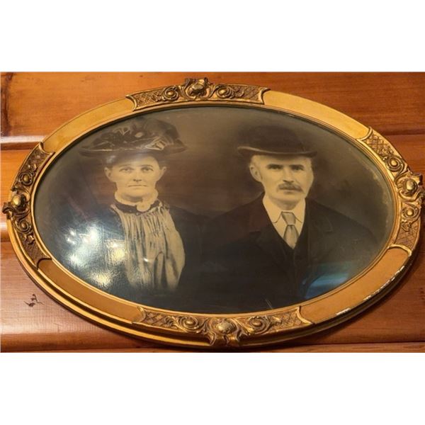 Oval Brass-Framed Sepia Photograph of Man and Woman