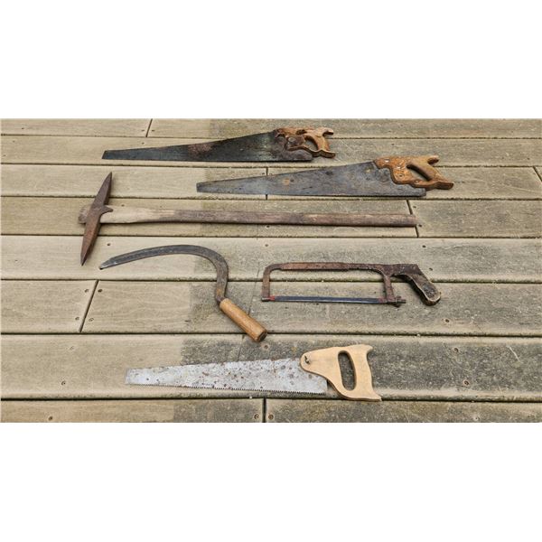 Six Vintage Hand Tools Including Saws, Sickle, Hacksaw, and Pickaxe
