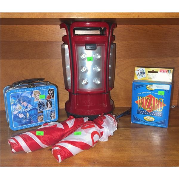 Wizard Card Game, Final Fantasy X Mini Tin, Battery Lantern, and Two Umbrellas