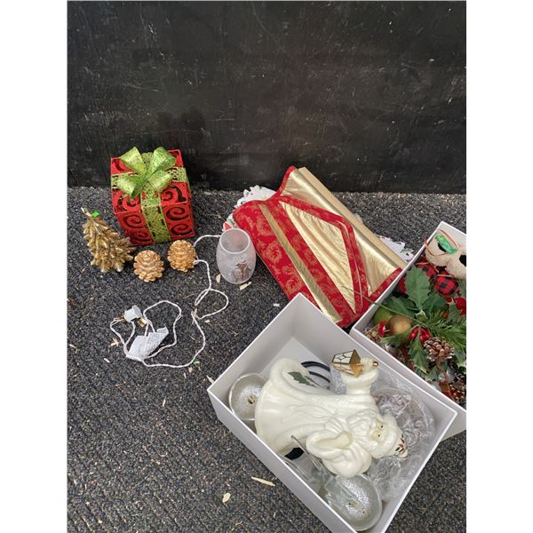Christmas Decor Including Santa Figurine, Ornaments, and Tree Skirt