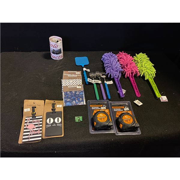 Lot of new items from gift shop including measuring tapes, dusters, luggage tags and more