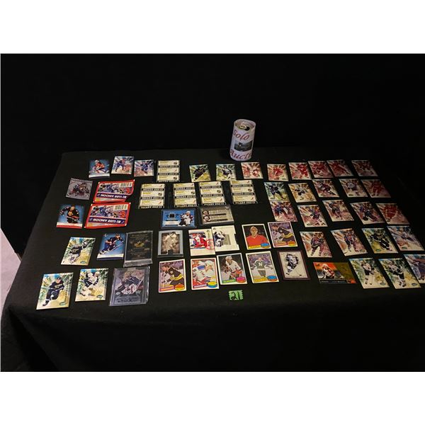 Large lot of hockey cards, some priced as high as 25.00