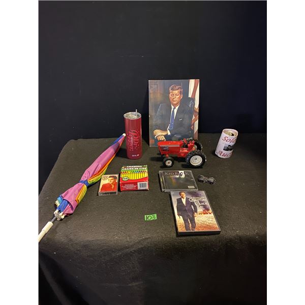 Collection of assorted items including JFK picture, DVD and music CD, audio cassette, umbrella and m