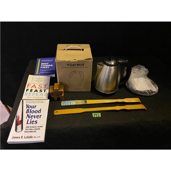 Assorted home items including tea kettle, health books, back scratchers and more