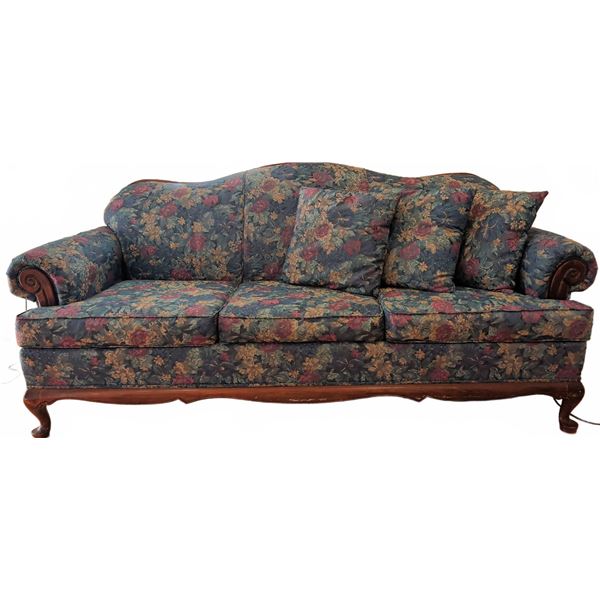 Floral Upholstered Sofa with Carved Wood Frame and Three Throw Pillows