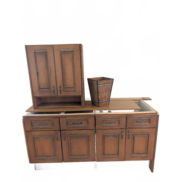 Wood Cabinets With Blue Inlay Details and Matching Waste Bin