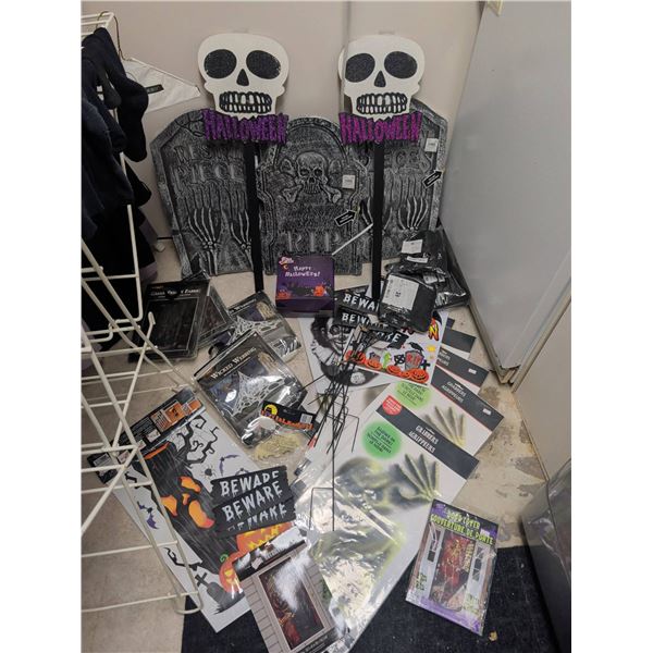 Halloween Decorations Including Tombstones, Door Covers, Wicked Webbing, and Signs