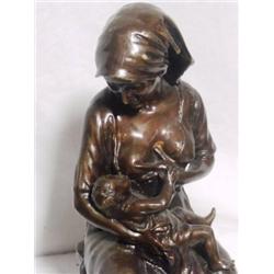 Mother Breastfeeding Infant By Gory