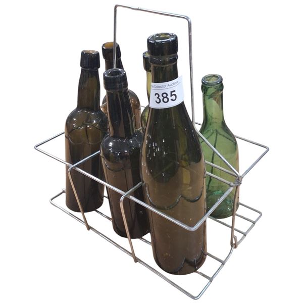 6 vintage glass bottles in metal carrying case