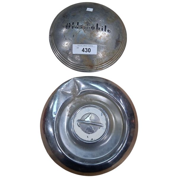 2 vintage hubcaps
