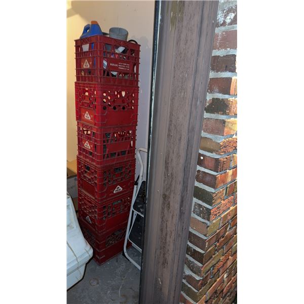 Stack of Palm Red Plastic Milk Crates and Folding Step Stool