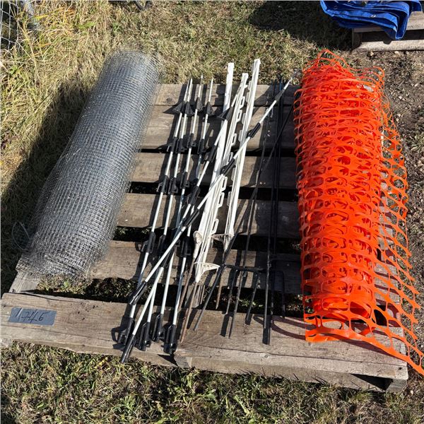 Pallet of orange snow fence, plastic garden screen, electric fence posts, metal stakes