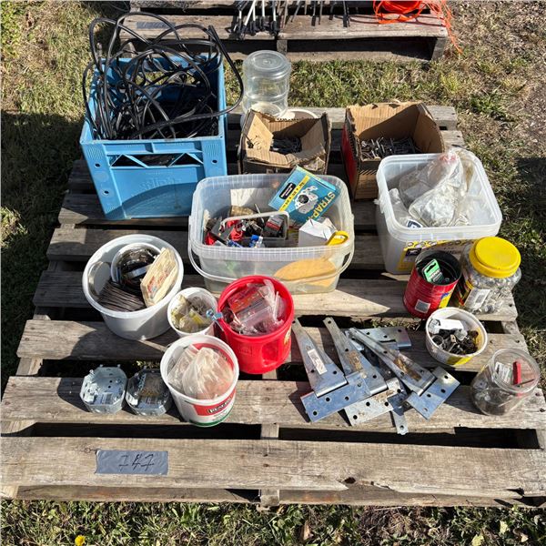 Pallet of misc screws, nails, door hinges, hay wire, misc parts