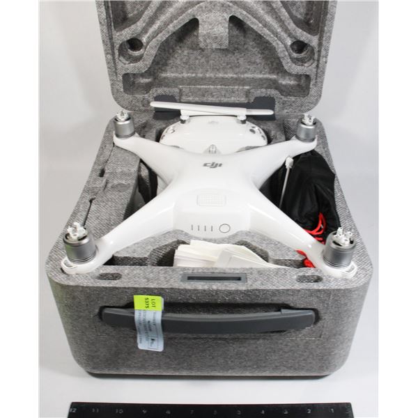 DJI PHANTOM 4 DRONE W/ CASE AND PROPELLORS
