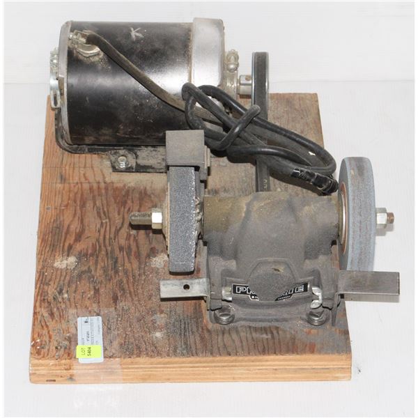 BENCH GRINDER ATTACHED TO BOARD WITH