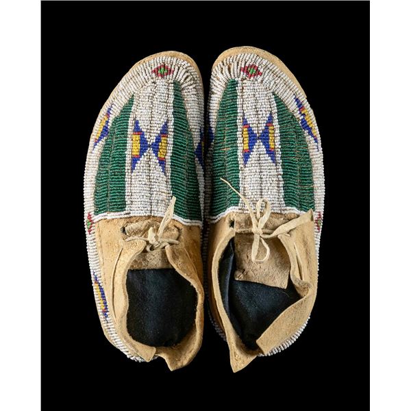 CHEYENNE BEAD DECORATED CHILD'S MOCCASINS.