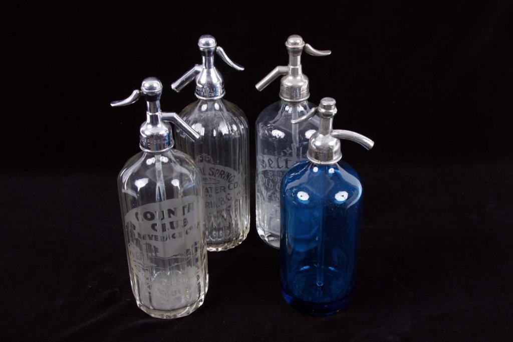 Collection of Four Antique Seltzer Bottles Including a Country Club Beverage Co etched glass from Va