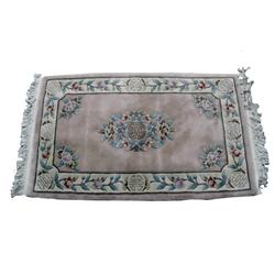 Asian Area Rug in pastel rose pattern made by the Middle Eastern Rug Co. 100% wool pile. Shows stain