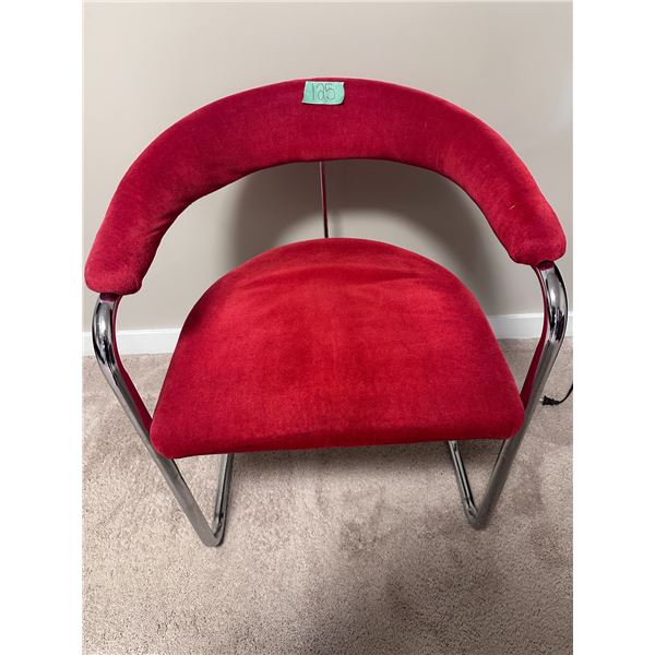 Metal framed chair with red upholstery