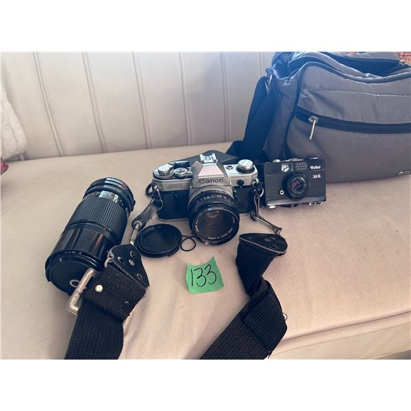 Cannon AE-1 film camera with carrying case and extra lens