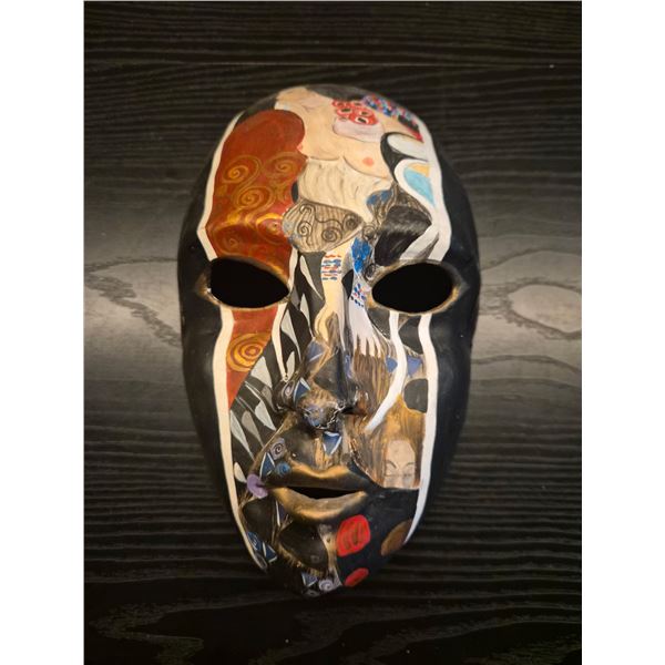 Ornately painted wall mask