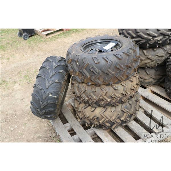 Four ATV tires on rims. Three are matching. See photos for makes and sizes
