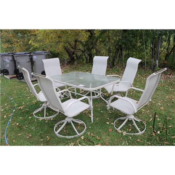 Patio table and six swivel armchairs in near new condition