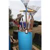 Image 1 : Rain barrel with large selection of rakes, shovels, picks etc.