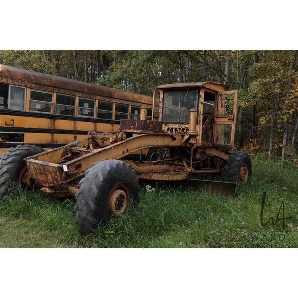 Vintage grader. Not running, but appears mostly complete. Possible project or a construction company