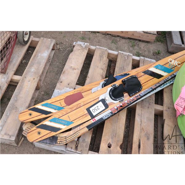 Pair of OMC 60 water skis and two hockey sticks