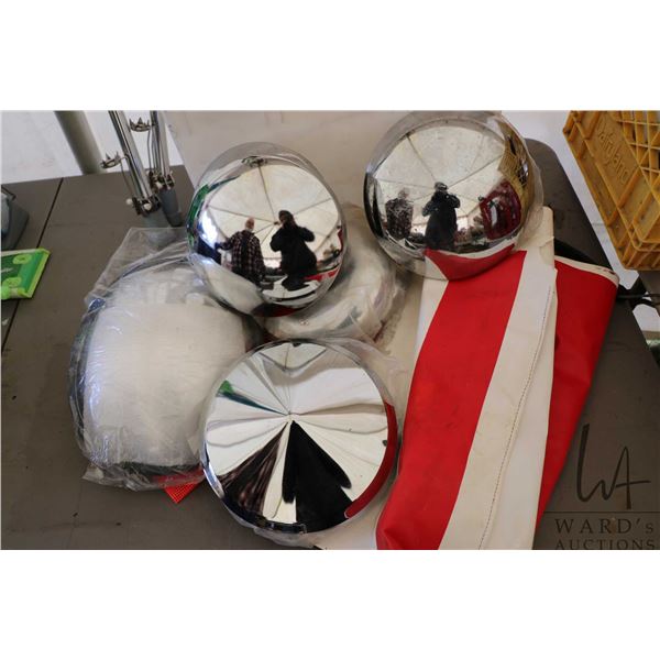 Selection of heavy truck hub caps, a side mirror and flags