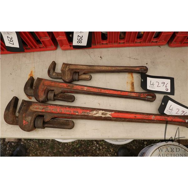 Three graduated sized Ridgid pipe wrenches