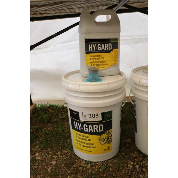 Three quarters filled 18.9 ltr. pail of Hy-Gard hydraulic oil plus a full 3.78 ltr.